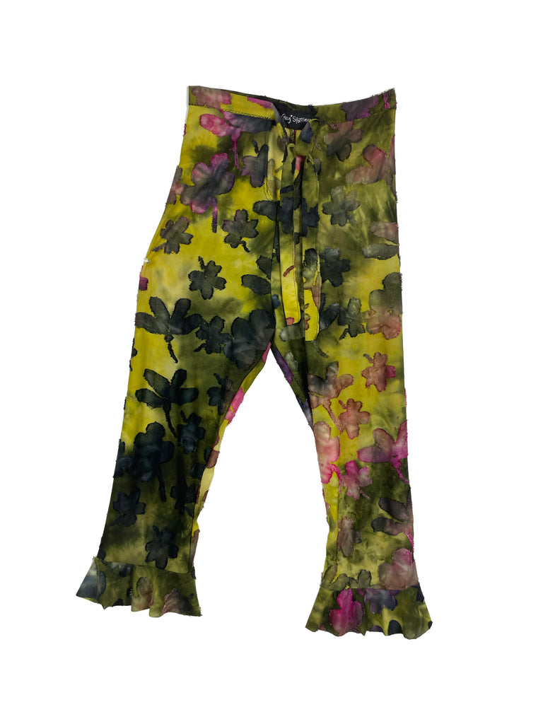 Floral tie dye jacquard patterned capri pants with a high waist and frill at the calf on a white background