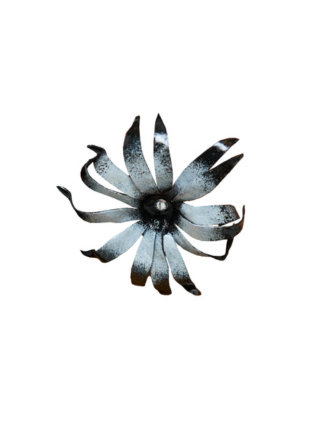 black and white flower with crystal in centre, on white background