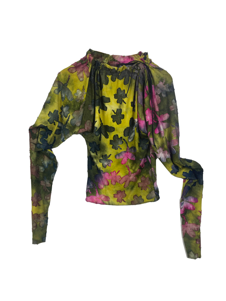 Floral patterned top with long sleeves on a white background