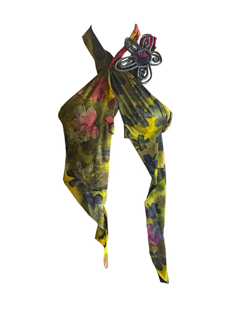 Floral patterned multi wear top, skirt, belt with a decorative metal belt buckle on a white background