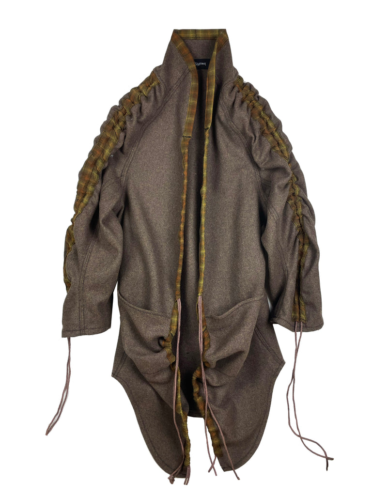 Brown heavy weight wool jacket coat with ruffled sleeves and shoulders with drawstrings and large pockets on a white background